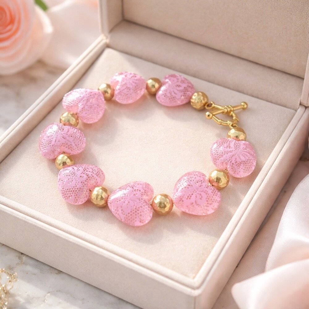 Beautiful pink hearts and gold tone bracelet